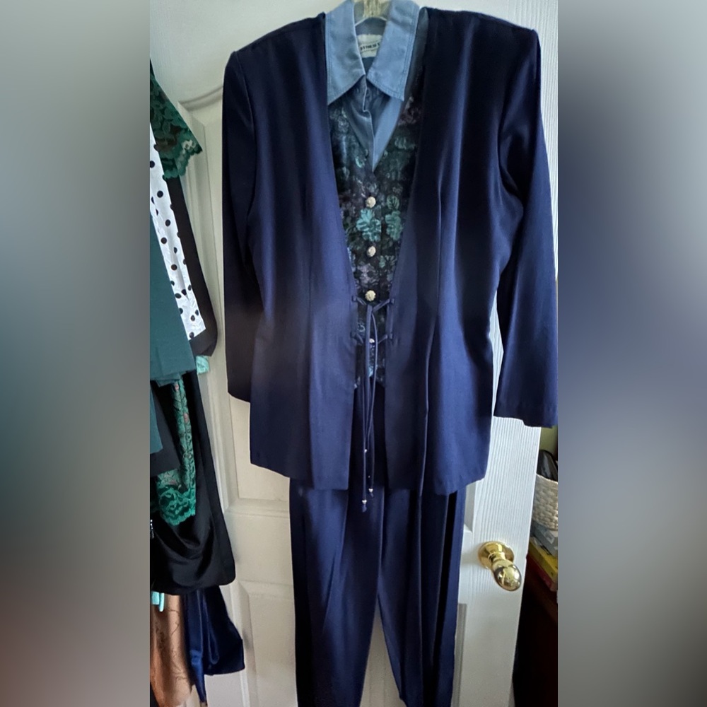 Attractive Navy Blue Suit with attached fooler vest and pull on pants.